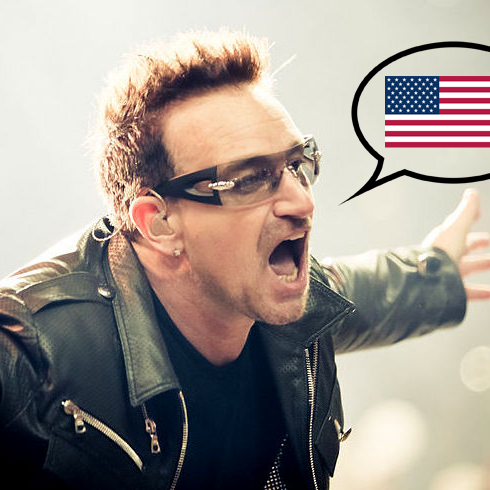 Bono from U2 with an American flag inside a speech bubble